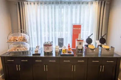 a counter with some food on it in front of a window at Hampton Inn & Suites Berkshires-Lenox in Lenox