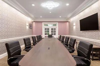a large conference room with a long table and chairs at Hampton Inn & Suites Stamford in Stamford