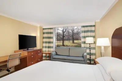 a hotel room with a bed and a television at DoubleTree by Hilton Stamford in Stamford