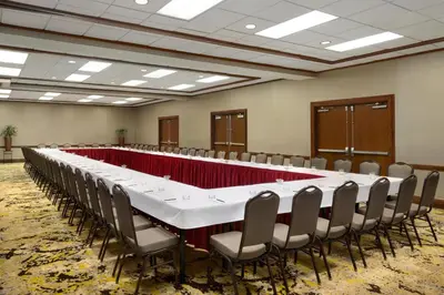 a long table in a room with chairs at DoubleTree by Hilton Stamford in Stamford