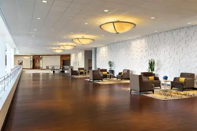 a lobby with couches and chairs in a building at DoubleTree by Hilton Stamford in Stamford