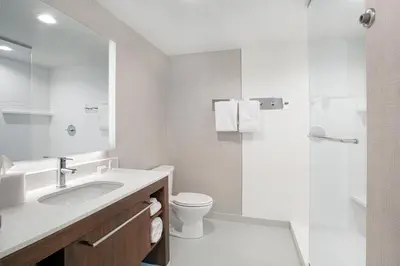 a bathroom with a sink and a toilet and a shower at Residence Inn by Marriott Norwalk in Norwalk