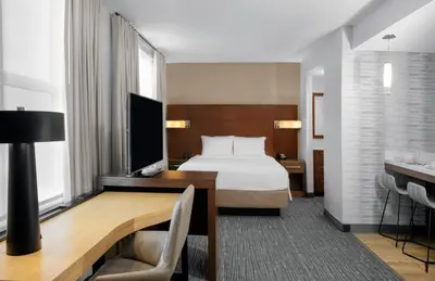 a hotel room with a bed and a desk at Residence Inn by Marriott Norwalk in Norwalk