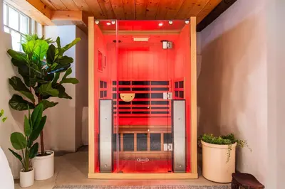 a glass elevator in a room with potted plants at Hotel Kinsley, a Member of Design Hotels in Kingston