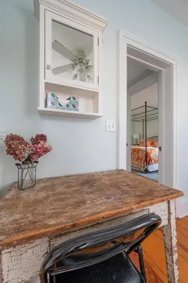 a table in a room with a mirror at The Gables of Rhinebeck in Rhinebeck