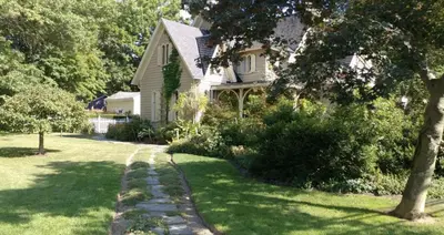 a house with a garden and a walkway at The Gables of Rhinebeck in Rhinebeck