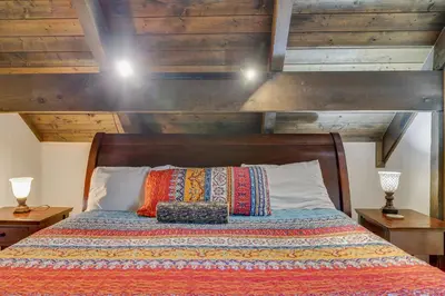 a bedroom with a bed with a wooden ceiling at ⛰⛵️⛱Mt. Maplewood Lodge❤️Seasonal Specials ☆Poconos☆Cabin☆Hot⛷Tub☆Game Room☆ in Pocono Pines