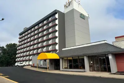 a large building with a clock tower on top of it at La Quinta by Wyndham Stamford / New York City in Stamford