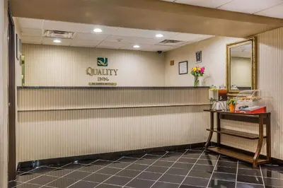 a waiting room with a counter and a mirror at Quality Inn Hyde Park - Poughkeepsie North in Hyde Park