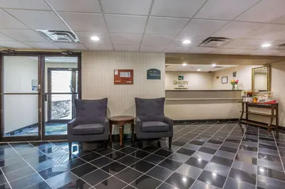 a waiting room with two chairs and a table at Quality Inn Hyde Park - Poughkeepsie North in Hyde Park