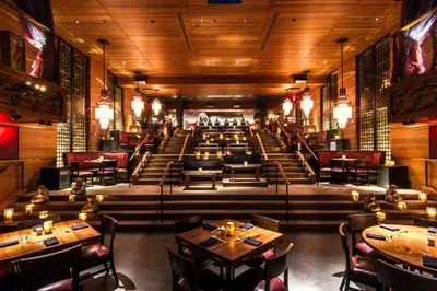 a restaurant with tables and chairs in a room at The Maritime Hotel in New York