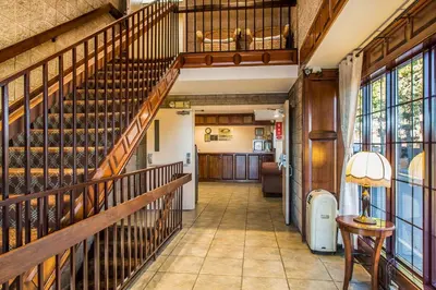 a hallway with a staircase in a building at Econo Lodge Milldale - Southington in Plantsville