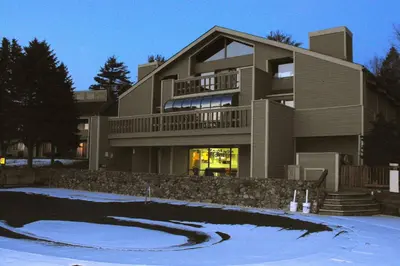 a large building with a driveway in front of it at Tanglwood Resort in Hawley