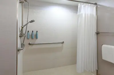 a shower with a shower curtain in a bathroom at Courtyard by Marriott Oneonta in Oneonta