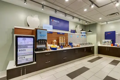 an apple store with a counter with an apple kiosk at Holiday Inn Express & Suites - Saugerties - Hudson Valley by IHG in Saugerties