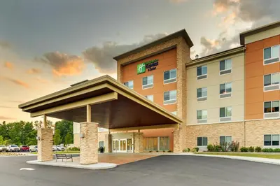 a rendering of a hotel building with a parking lot at Holiday Inn Express & Suites - Saugerties - Hudson Valley by IHG in Saugerties