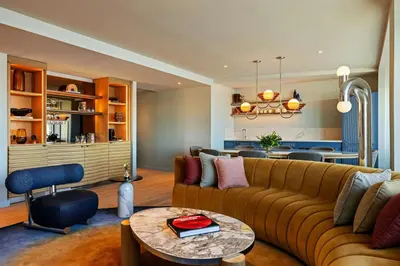 a living room with a couch and a table at W Hoboken in Hoboken