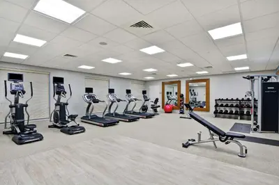 a gym with treadmills and elliptical machines at Homewood Suites By Hilton Hadley Amherst in Hadley