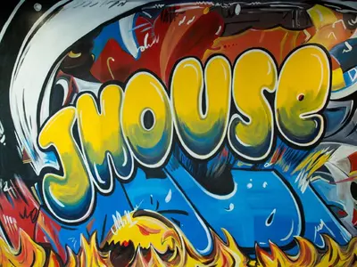 a graffiti sign with the word smash on it at The J House Greenwich Hotel in Greenwich