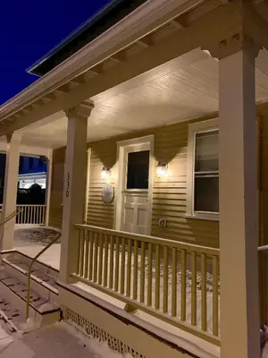 a front porch of a house at night at Nest Hudson in Hudson