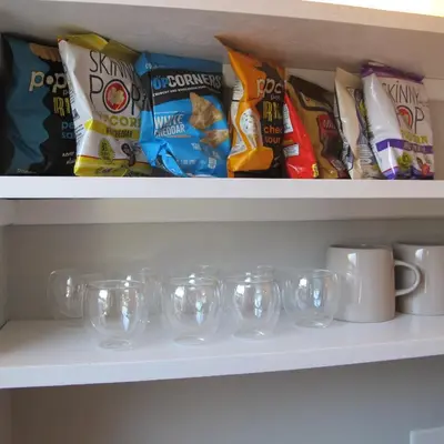 a shelf filled with lots of different types of chips at Nest Hudson in Hudson