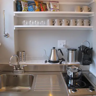 a kitchen with a sink and a stove at Nest Hudson in Hudson