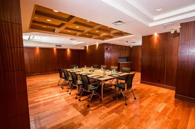 a conference room with a long table and chairs at The Belvedere Hotel in New York