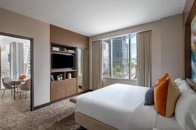 a hotel room with a large bed and a large window at Courtyard New York Manhattan/Midtown West in New York