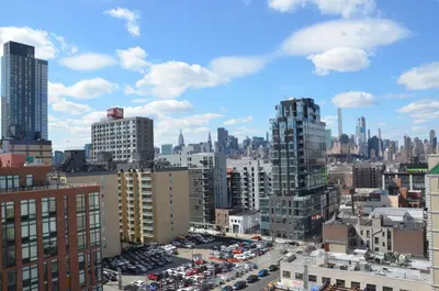 a view of a city with buildings and cars at LIC Plaza Hotel in Queens