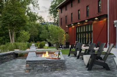 a fire pit in a courtyard next to a building at The Williams Inn in Williamstown