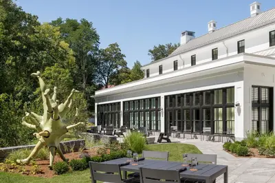 a large building with a statue of a tree at The Williams Inn in Williamstown