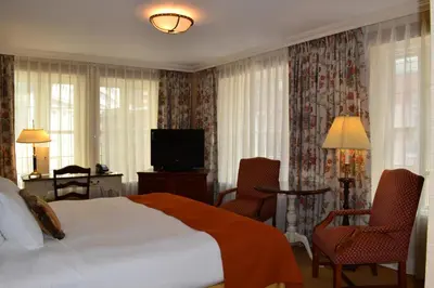 a hotel room with a bed and a television at The Wall Street Inn in New York