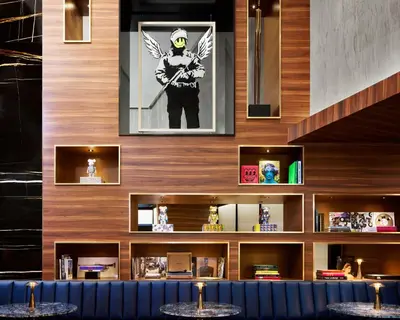 a bar with a picture of a man with a bat at Gansevoort Meatpacking in New York