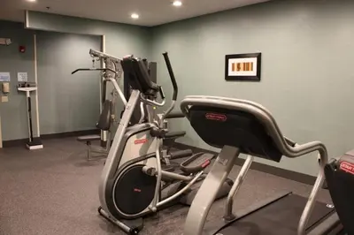 a room with a gym with a treadmill at Holiday Inn Express - Ludlow - Chicopee Area by IHG in Ludlow