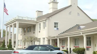 a car parked in front of a building at New Haven Inn in New Haven