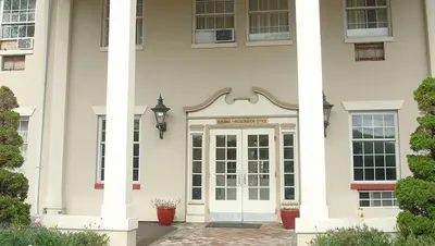 a front door of a house with columns at New Haven Inn in New Haven