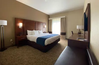 a hotel room with a bed and a window at Comfort Inn East Windsor - Springfield in East Windsor