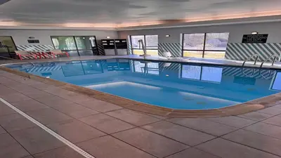 a large swimming pool in a hotel room at Holiday Inn Cheshire - Southington by IHG in Southington