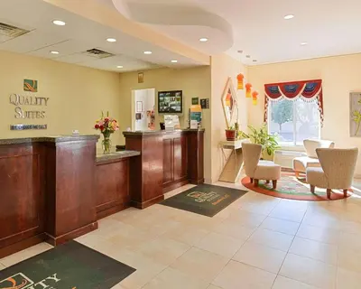 a waiting room at a quality smiles clinic with chairs at Quality Suites Stratford in Stratford