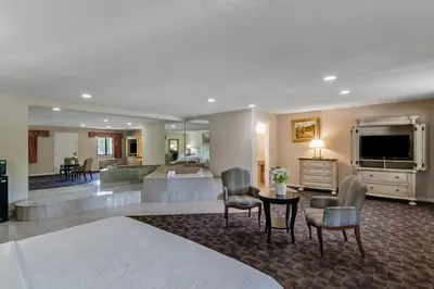 a living room with a television and a living room at Americas Best Value Inn Torrington, CT in Torrington