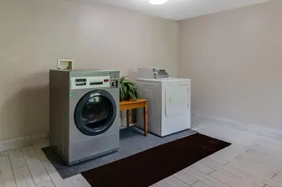 a washing machine and a dryer in a room at Americas Best Value Inn Torrington, CT in Torrington