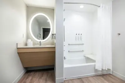 a bathroom with a sink and a mirror at TownePlace Suites by Marriott Hadley Amherst in Hadley