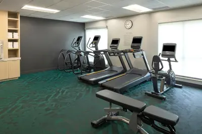 a gym with several treadmills and exercise bikes at TownePlace Suites by Marriott Hadley Amherst in Hadley