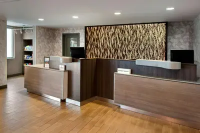 a lobby of an office with a reception desk at Fairfield Inn & Suites by Marriott Great Barrington Lenox/Berkshires in Great Barrington