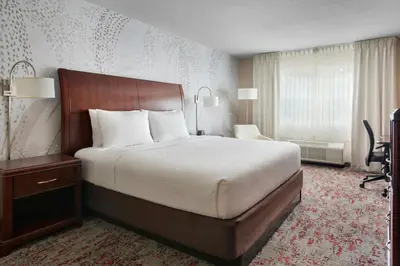 a hotel room with a large bed and a window at Fairfield Inn & Suites by Marriott Great Barrington Lenox/Berkshires in Great Barrington