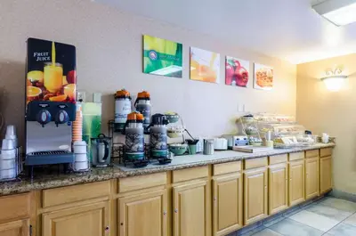 a kitchen with a counter with some food on it at Quality Inn Chicopee-Springfield in Chicopee