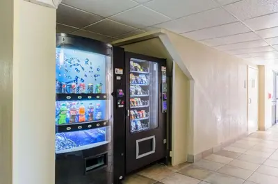 a vending machine in a building with drinks in it at Quality Inn Chicopee-Springfield in Chicopee