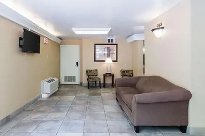 a living room with a couch and a television at Quality Inn Chicopee-Springfield in Chicopee