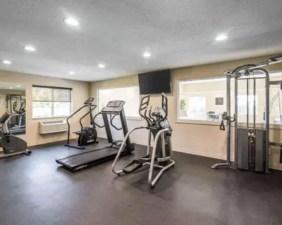 a gym with treadmills and ellipticals in a room at Comfort Inn Saugerties in Saugerties