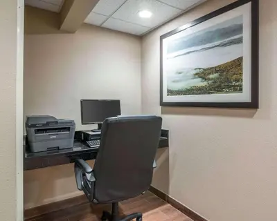 a office with a desk with a computer and a chair at Comfort Inn Saugerties in Saugerties